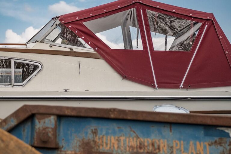 Boat with a burgundy canopy